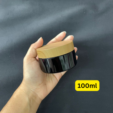 Luxury 100ml 120ml 150ml 200ml 250ml Black PET Jar with Round Plastic Bamboo Wood Plastic Cosmetic Cream Jar.