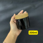 Luxury 100ml 120ml 150ml 200ml 250ml Black PET Jar with Round Plastic Bamboo Wood Plastic Cosmetic Cream Jar.
